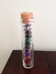 spool of thread in jar